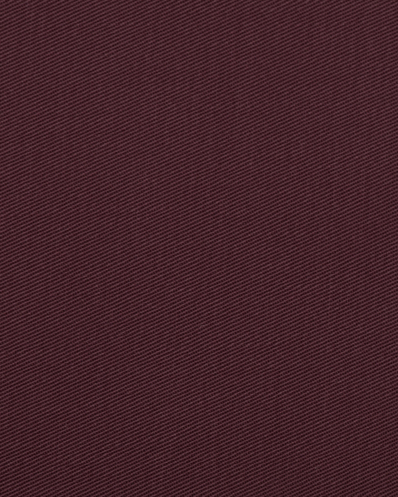 Close up view of custom Genoa Chino pants for men by Luxire in plum