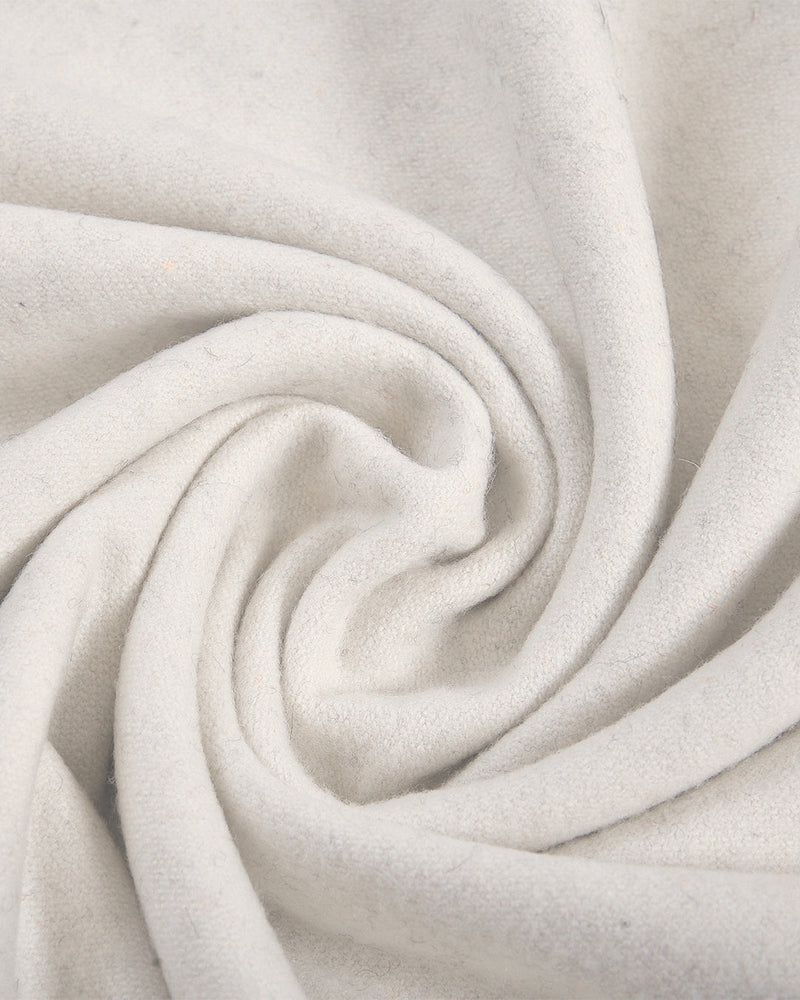 Closeup view of custom wool Chino pants for men by Luxire in cream