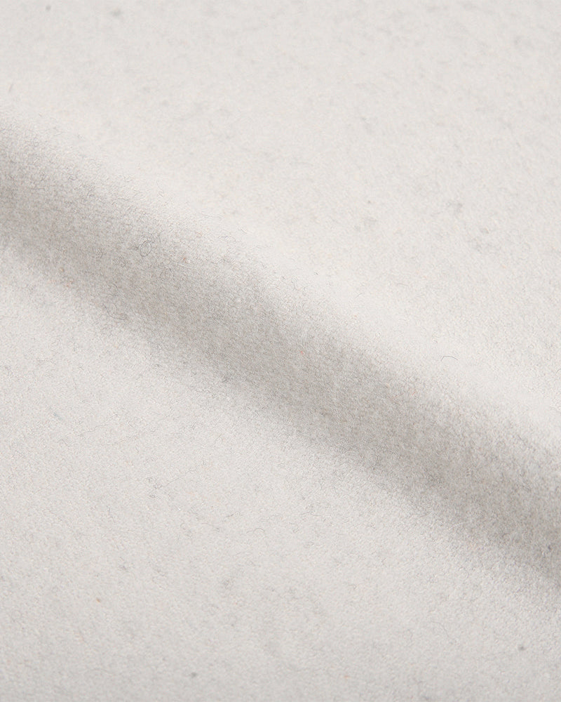 Close up view of custom wool Chino pants for men by Luxire in cream