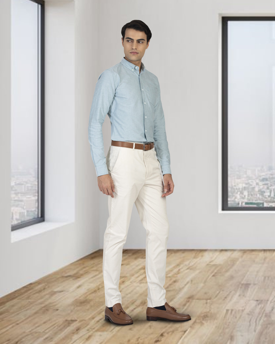 Model wearing custom Genoa Chino pants for men by Luxire in ivory cream wearing brown shoes