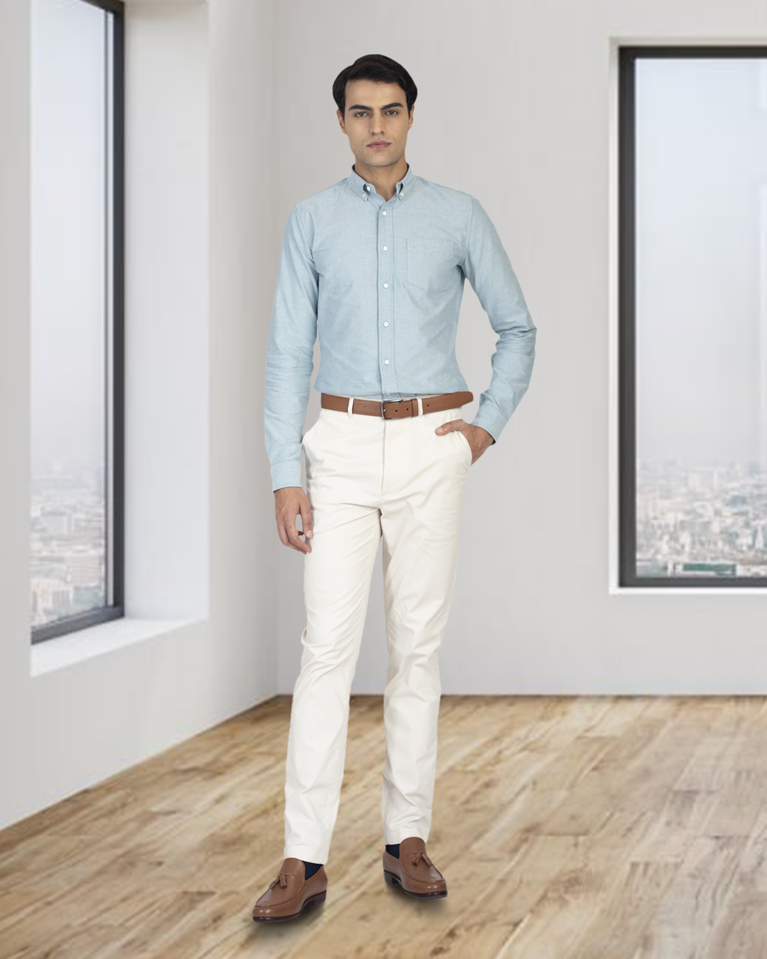 Model wearing the custom oxford shirt for men by Luxire in mint green one hand in pocket