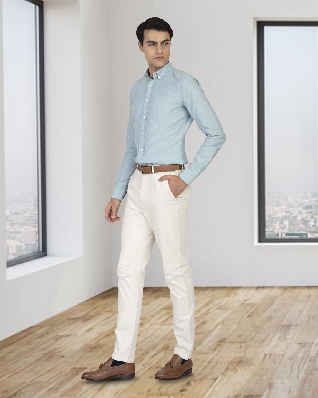 Model wearing the custom oxford shirt for men by Luxire in mint green one hand in pocket 2