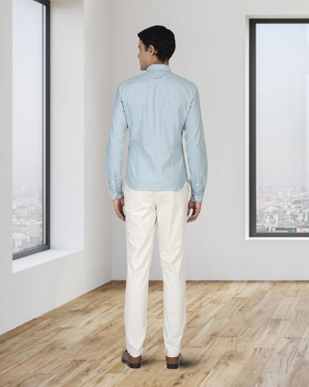 Back of model wearing the custom oxford shirt for men by Luxire in mint green shirt untucked