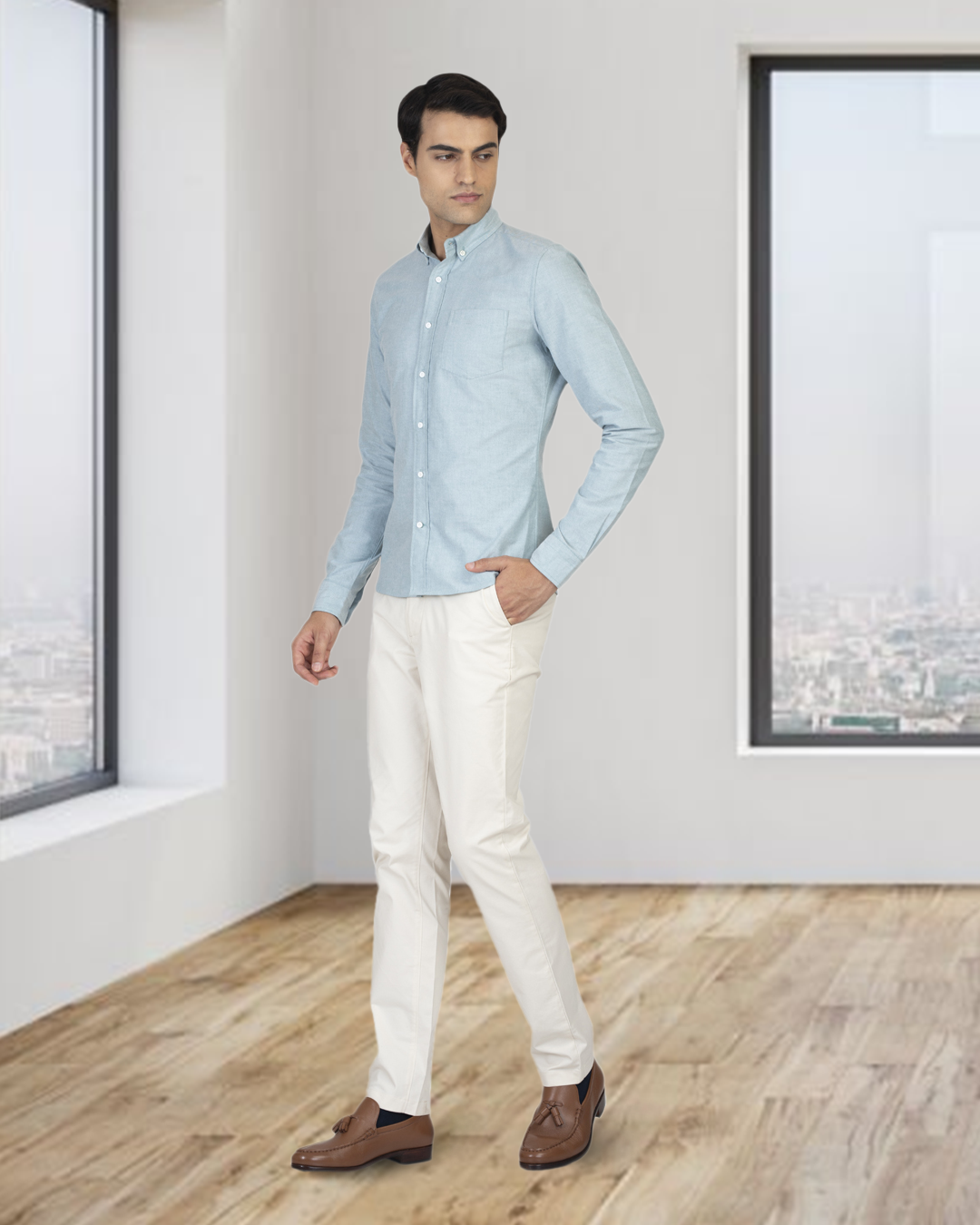 Side of model wearing the custom oxford shirt for men by Luxire in mint green hand in pocket