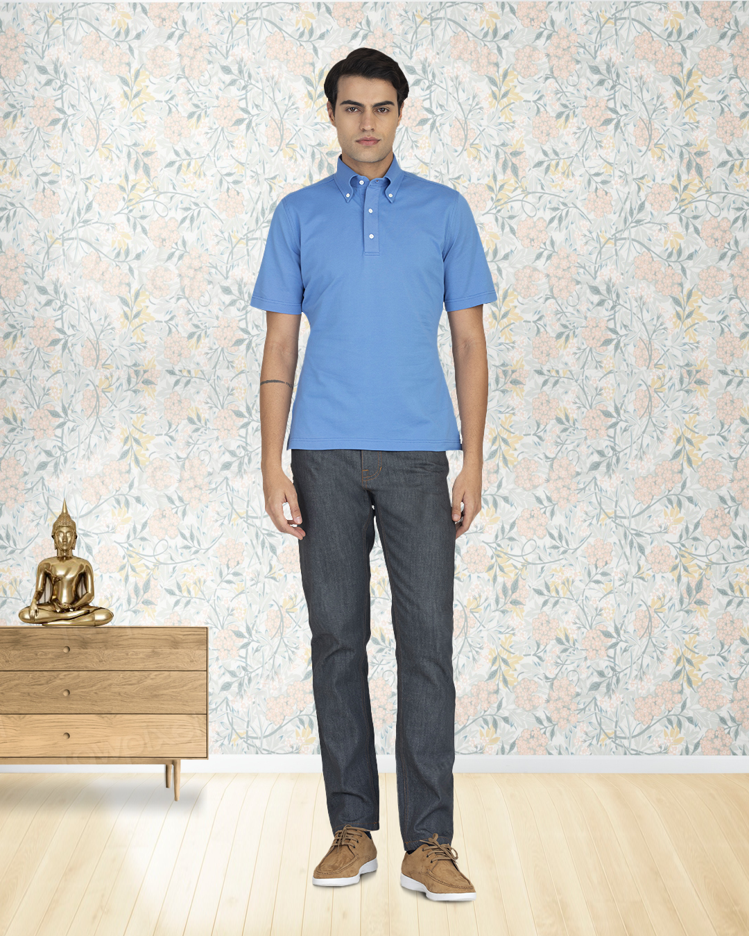 Front of model wearing the custom oxford polo shirt for men by Luxire in soft blue hands at side 2