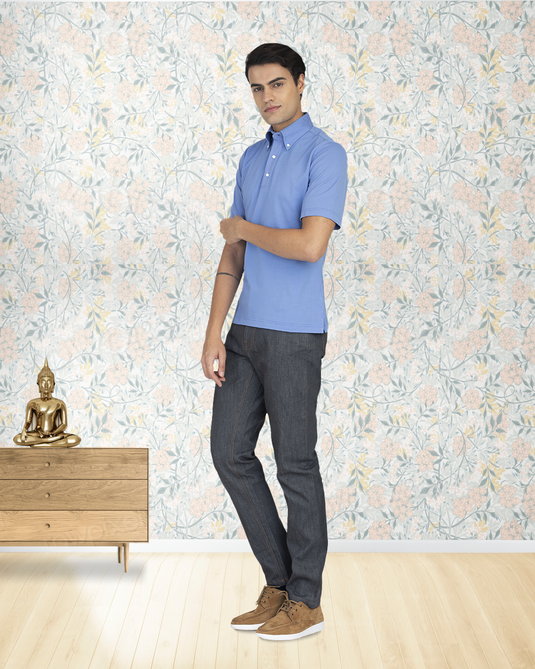 Side view of model wearing the custom oxford polo shirt for men by Luxire in soft blue 2