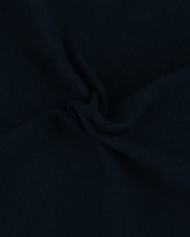 Close up fabric of the custom oxford polo shirt for men by Luxire in dark navy