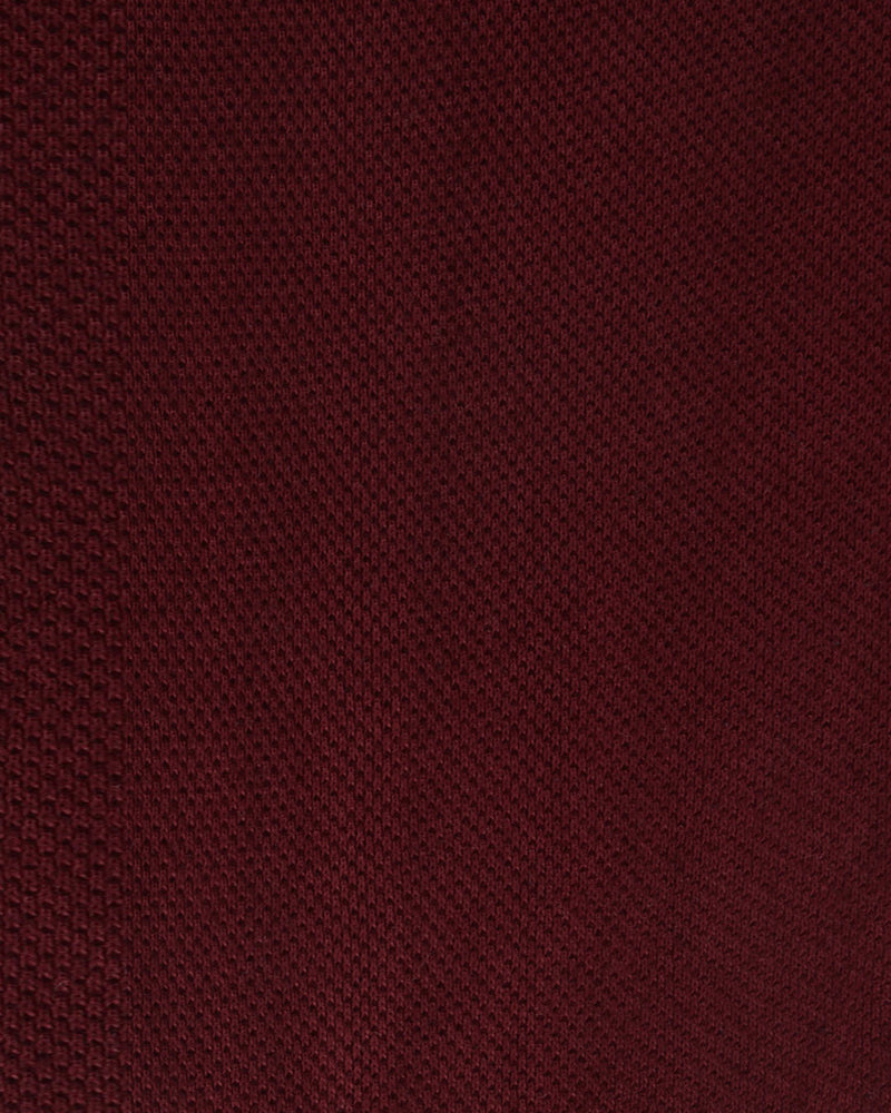 Close up of the custom oxford polo shirt for men by Luxire in maroon