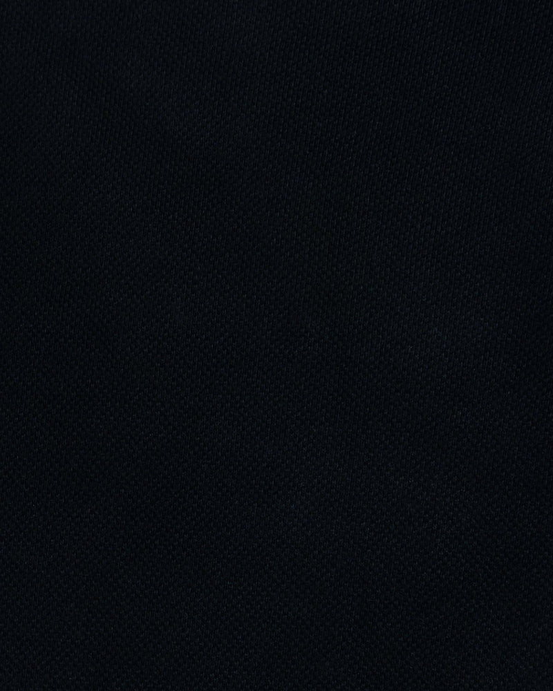 Close up fabric of the custom oxford polo shirt for men by Luxire in soft black