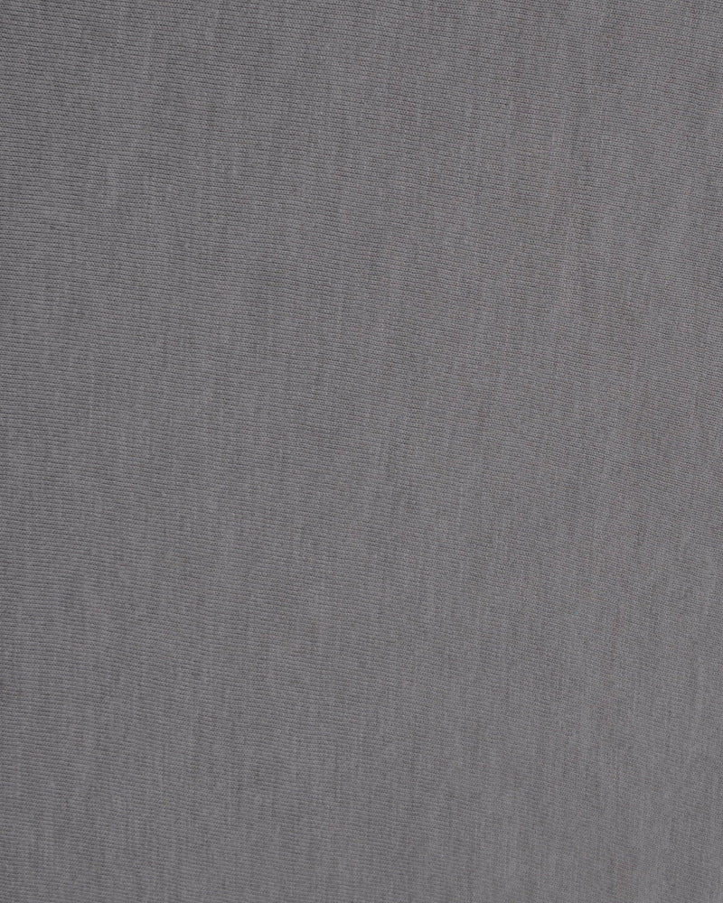Close up of the custom oxford polo shirt for men by Luxire in soft grey
