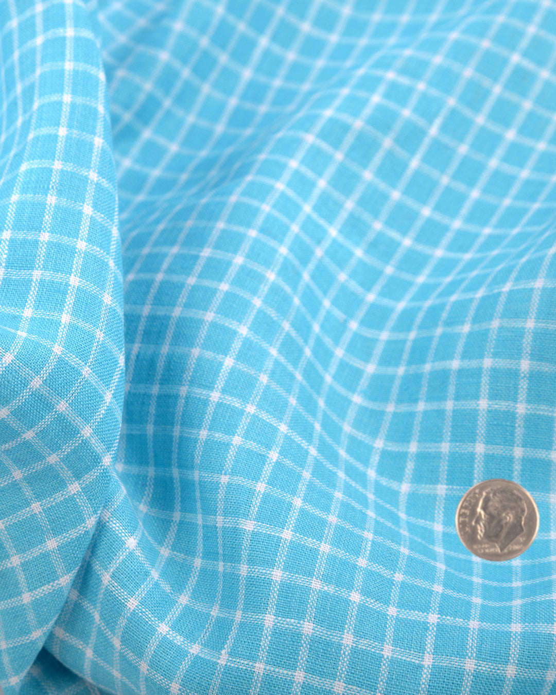 Close up of the custom linen shirt for men in teal and blue checks by Luxire Clothing