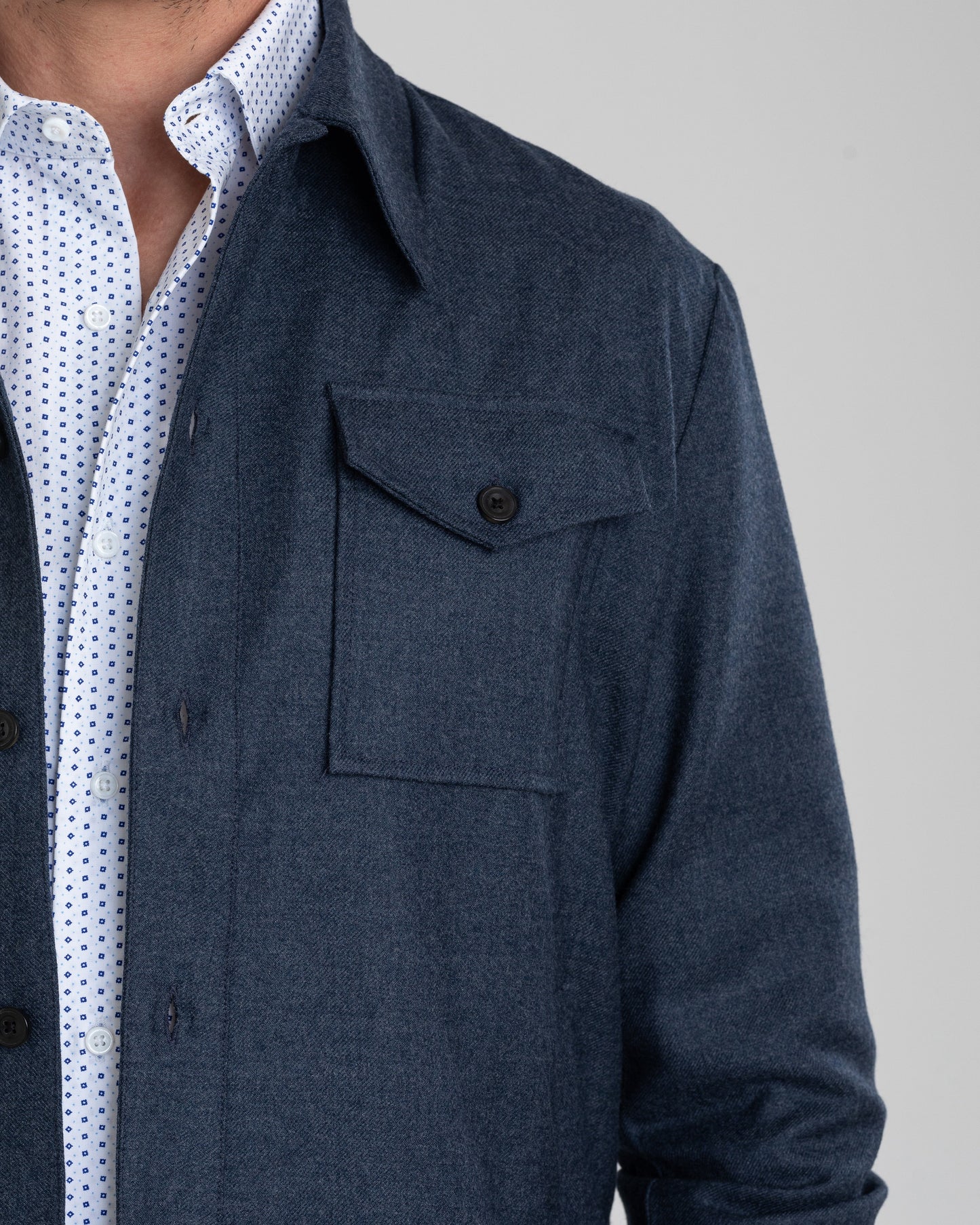 Close up of model wearing the wool flannel shirt jacket for men by Luxire in dugdale navy
