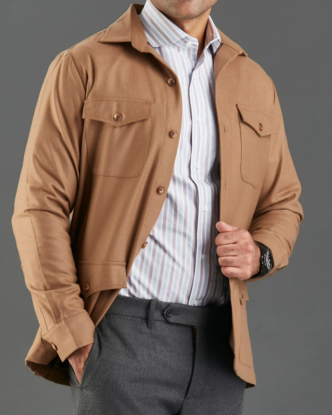 Front of model wearing the woolen flannel shirt jacket for men by Luxire in tan hand in pocket
