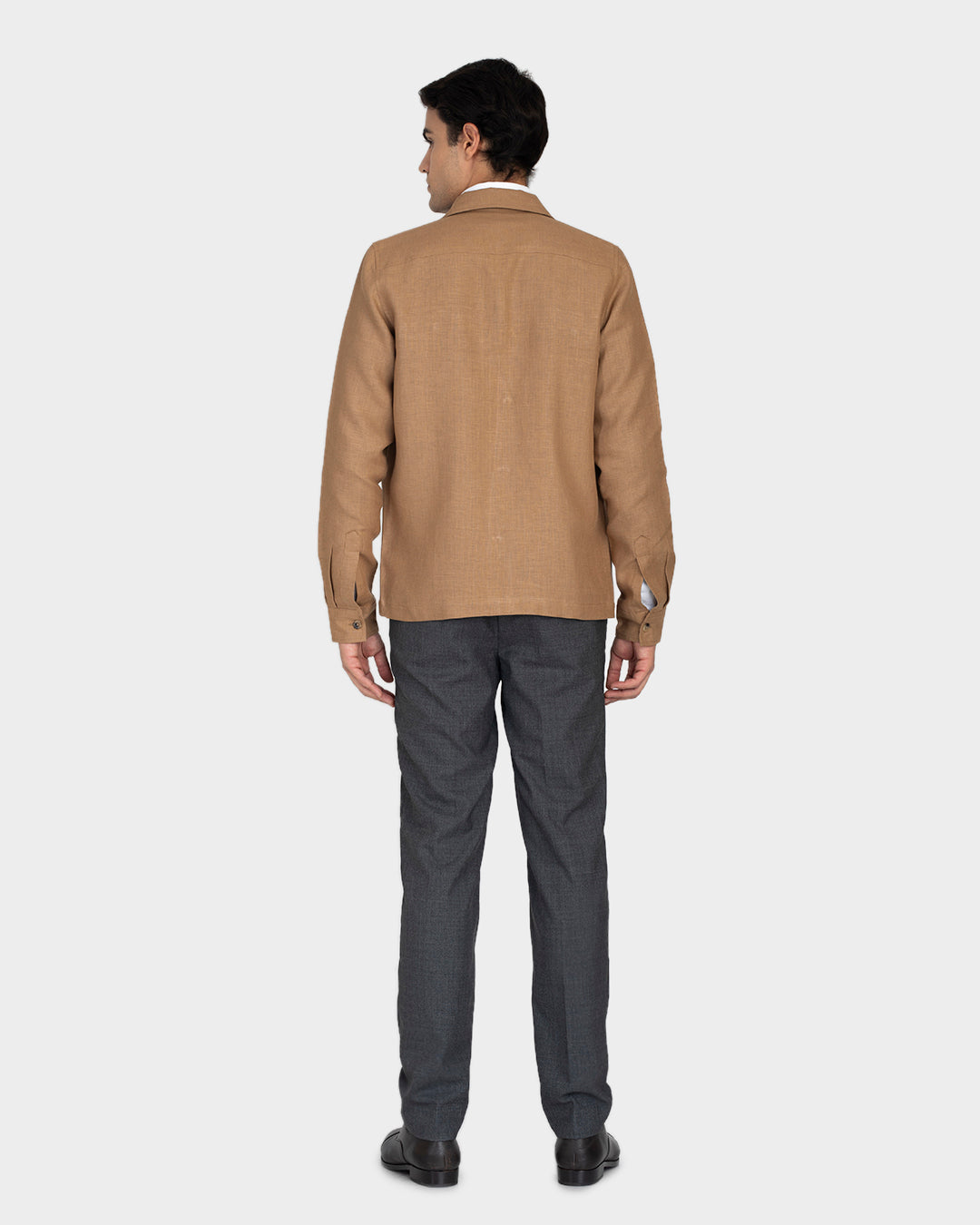 Back of model wearing the linen shirt jacket for men by Luxire in golden brown