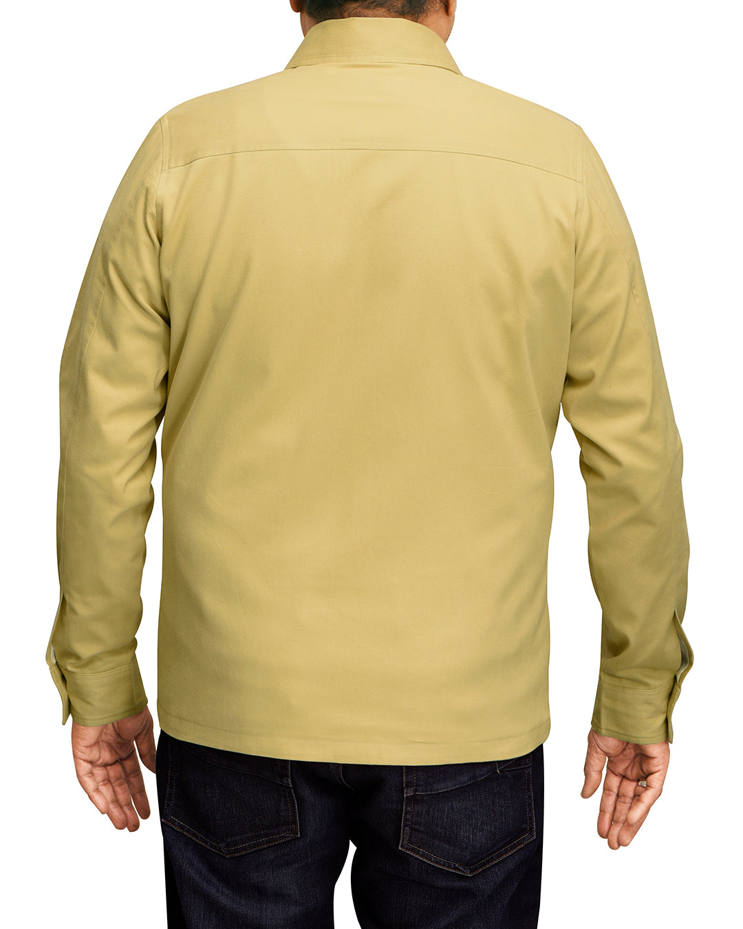 Back of model wearing the twill shirt jacket for men by Luxire in mellow mustard