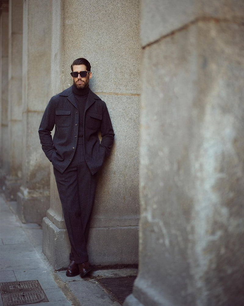 Model outside wearing the recycled wool shirt jacket for men by Luxire in charcoal grey