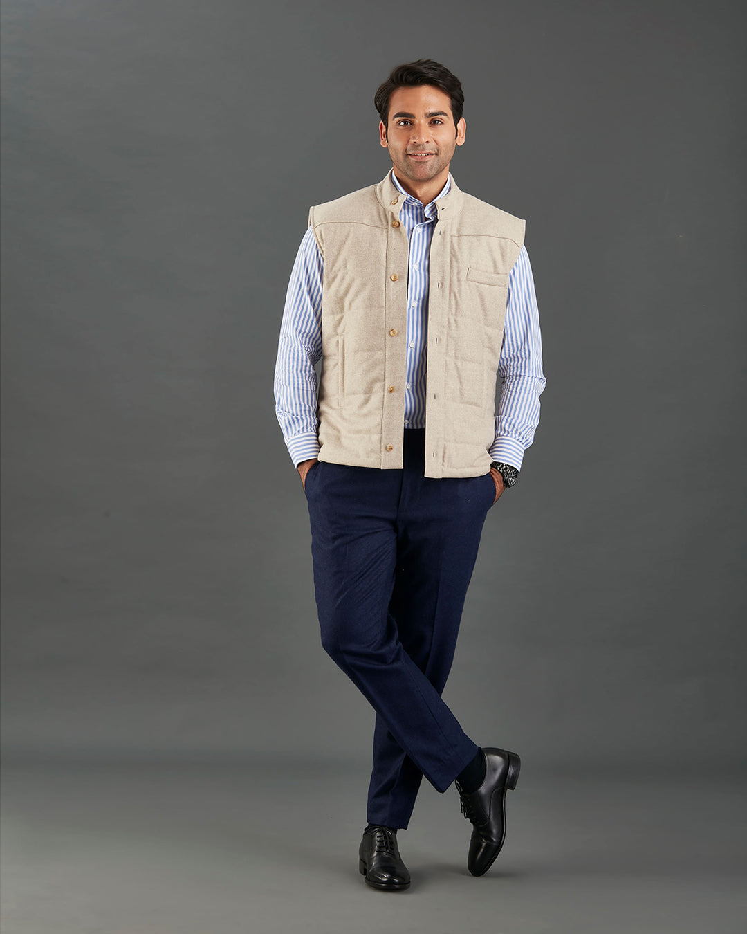Front of model wearing the flannel quilted vest for men by Luxire in ecru hands in pockets hands in pockets 2
