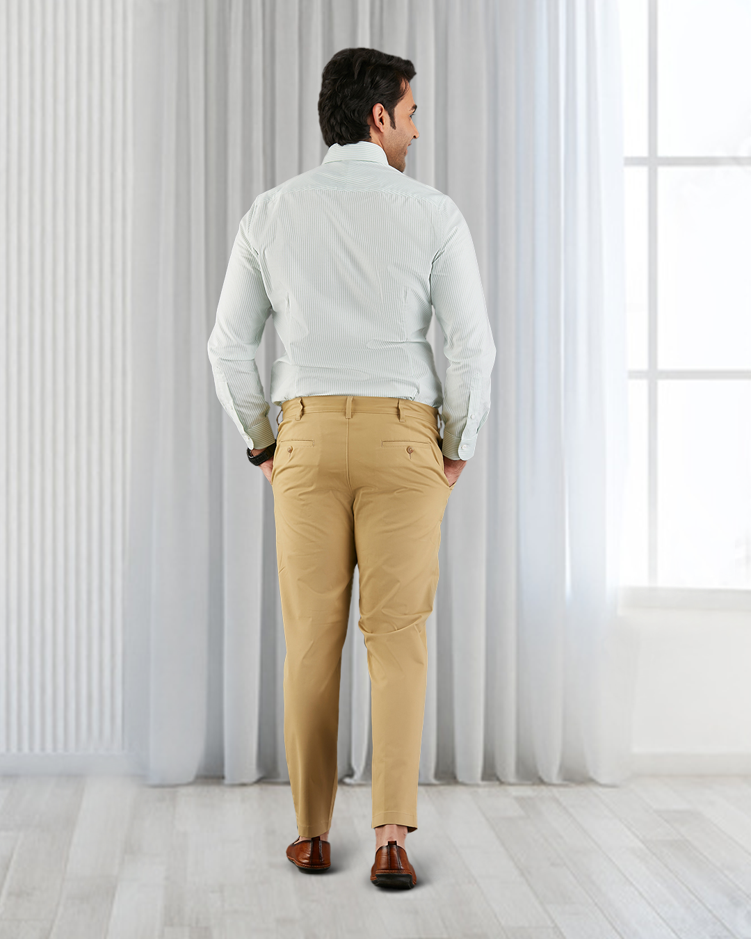 Back view of custom Genoa Chino pants for men by Luxire in khaki hands in pockets