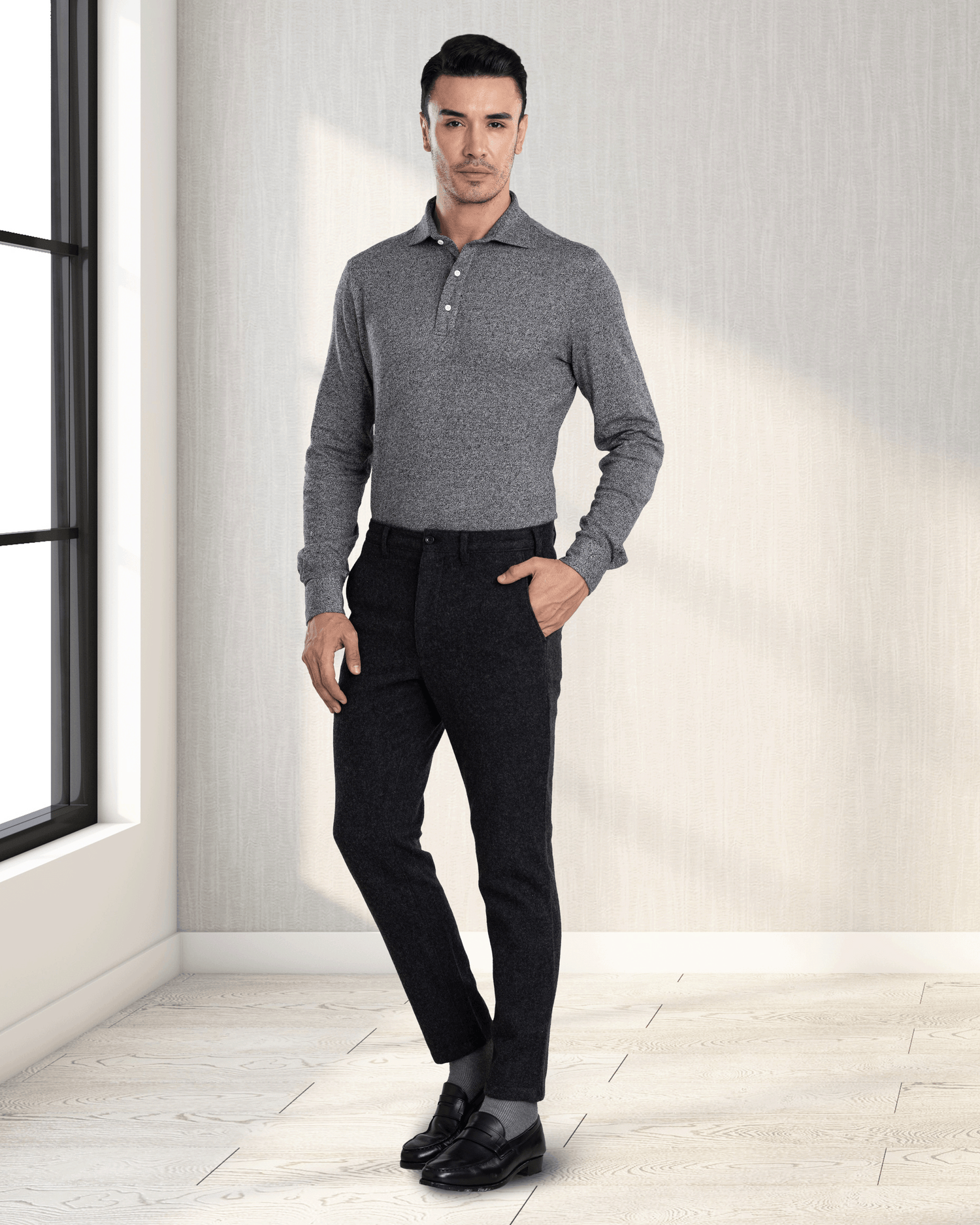 Model wearing custom wool Chino pants for men by Luxire in charcoal grey hand in pocket