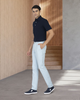 Model wearing custom Genoa Chino pants for men by Luxire in powder blue hand in pocket