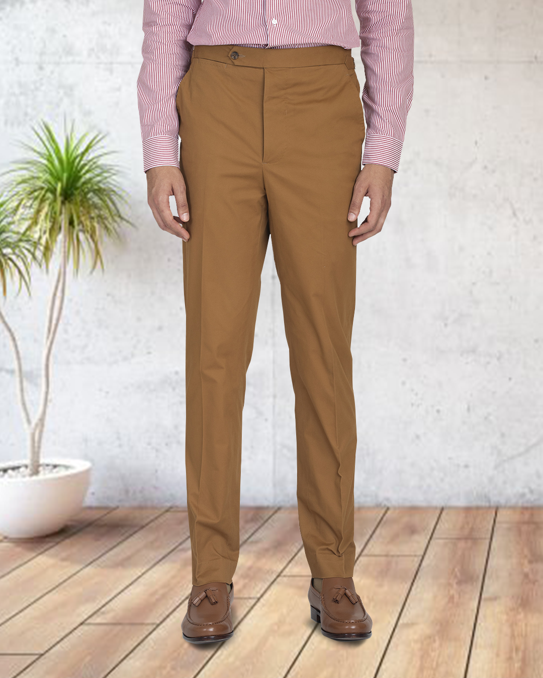 Bottom view of model wearing custom Genoa Chino pants for men by Luxire in copper