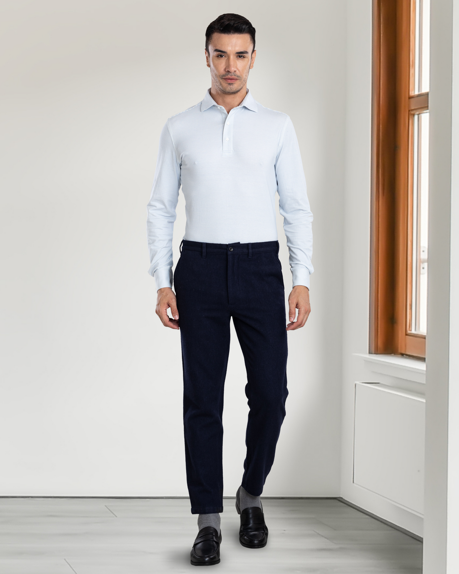 Front view of model wearing custom wool Chino pants for men by Luxire in navy