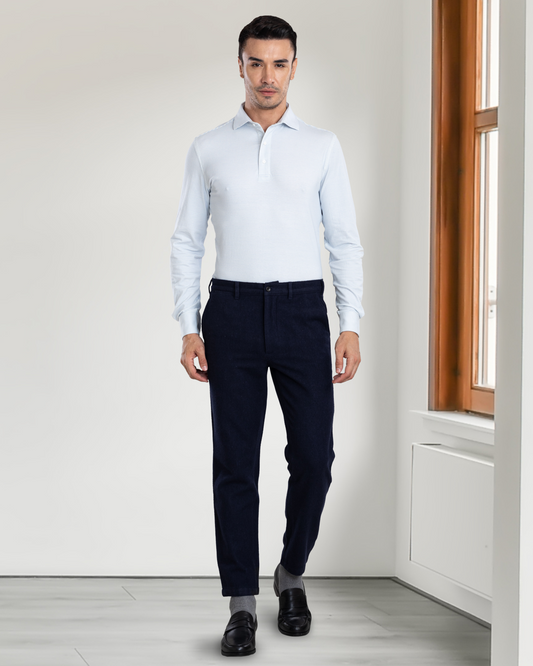 Front view of model wearing custom wool Chino pants for men by Luxire in navy