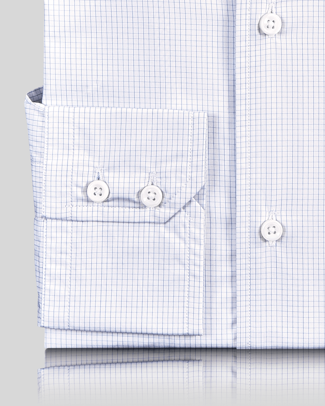 Close up cuff view of custom check shirts for men by Luxire brembana white and blue
