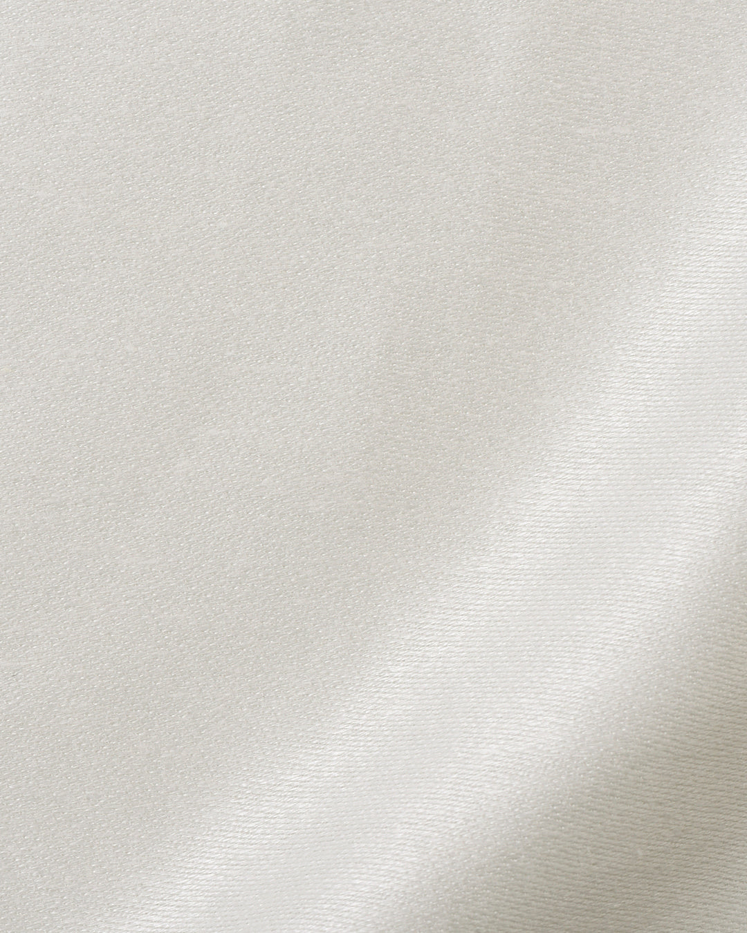 Close up view of custom linen sateen pants for men by Luxire in cream