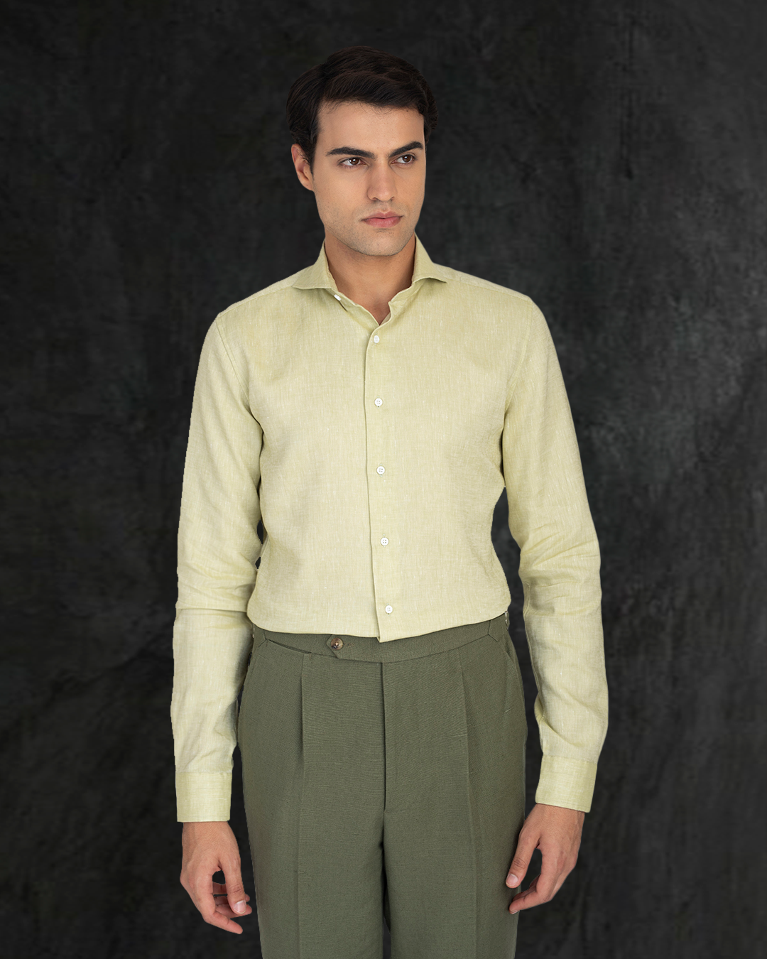 Front pose of male model wearing custom linen canvas pants for men by Luxire in olive green