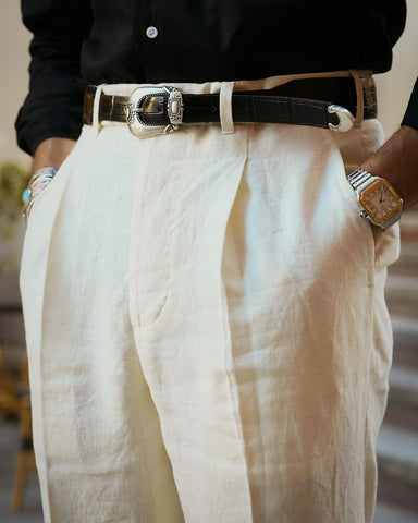 Model front view of custom linen Gurkha pants for men by Luxire in cream