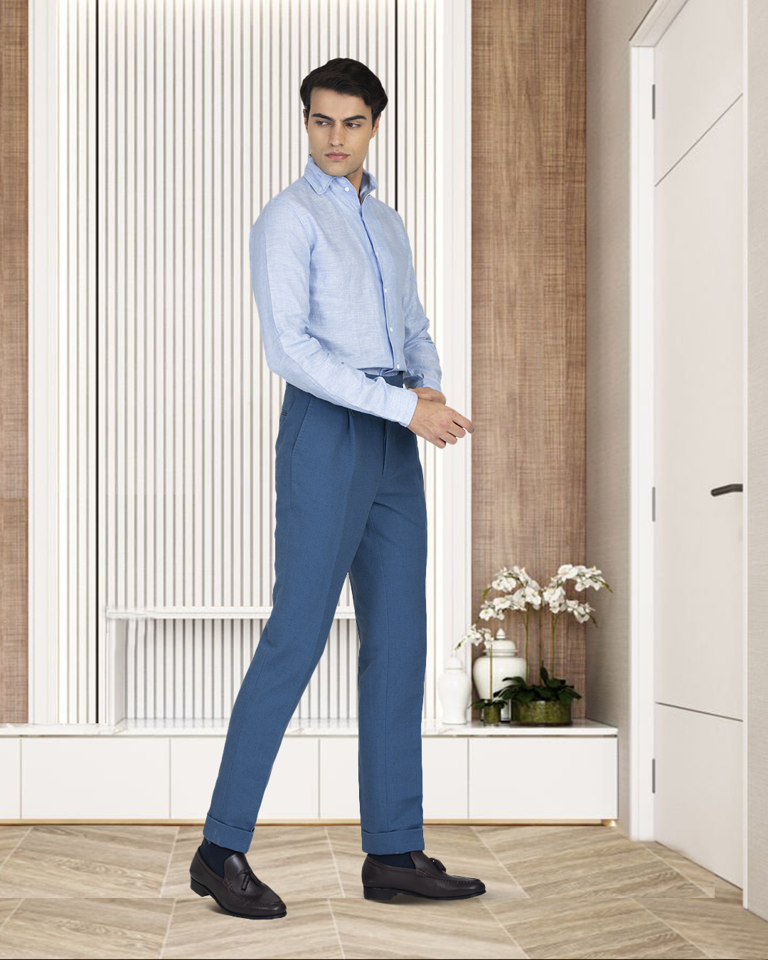 Male model in custom linen Gurkha pants for men by Luxire in olive hands together