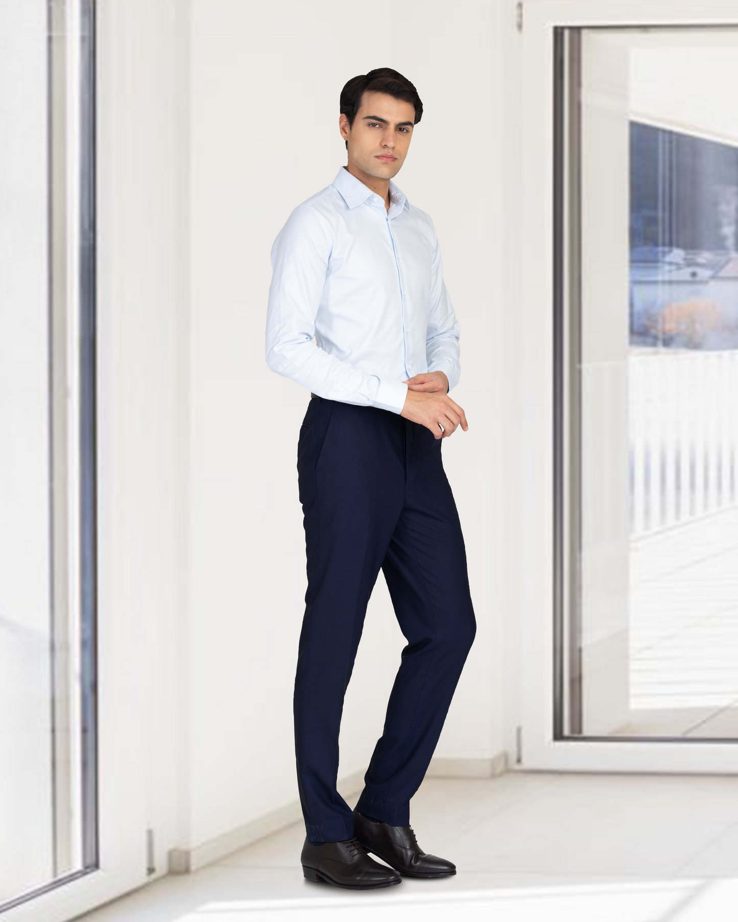 Model wearing the custom oxford shirt for men by Luxire in brembana business blue royal 2