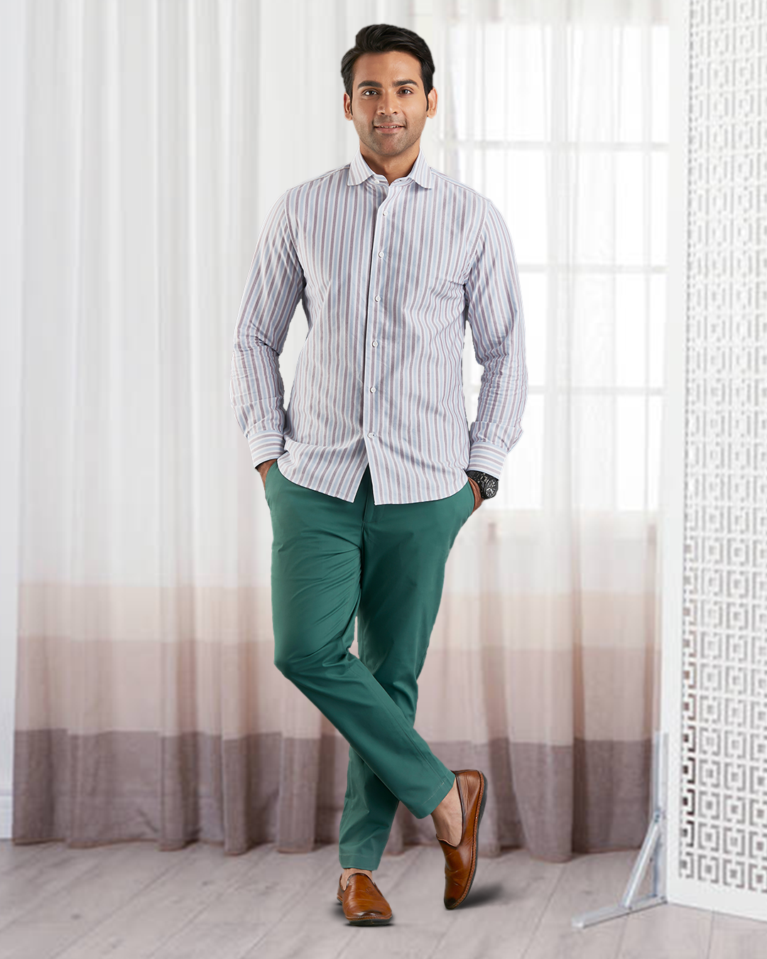 Model wearing the custom oxford shirt for men by Luxire in white with maroon and blue stripes hands in pockets