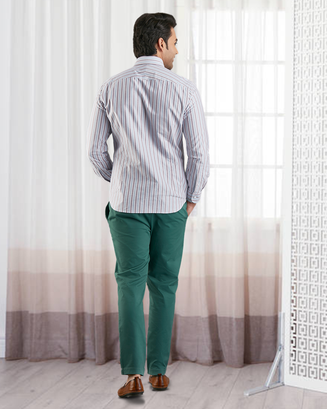 Back of model wearing the custom oxford shirt for men by Luxire in white with maroon and blue stripes