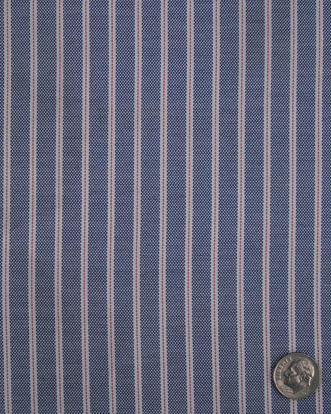 Close up of the custom oxford shirt for men by Luxire in navy awning with red pinstripes
