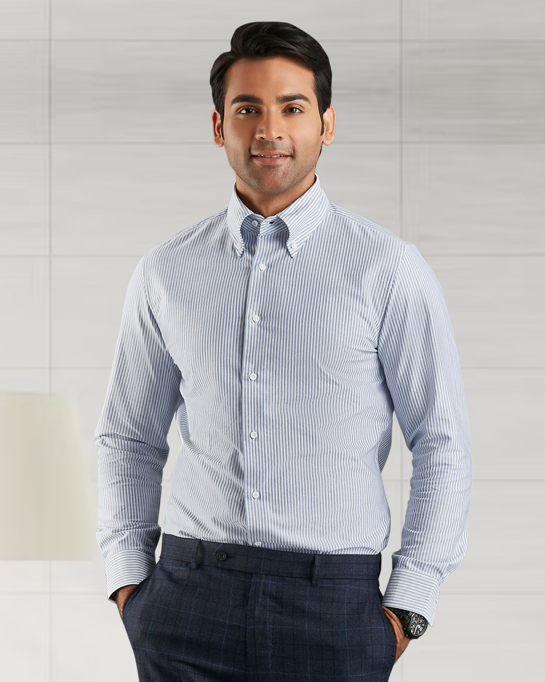 Close up of model wearing the custom oxford shirt for men by Luxire with navy university stripes hands in pockets