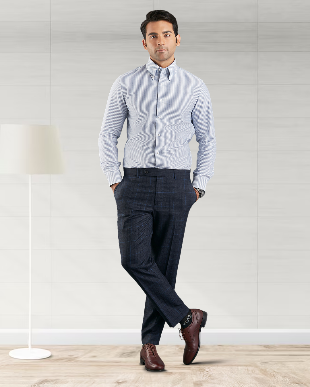 Front of model wearing the custom oxford shirt for men by Luxire with navy university stripes hands in pockets