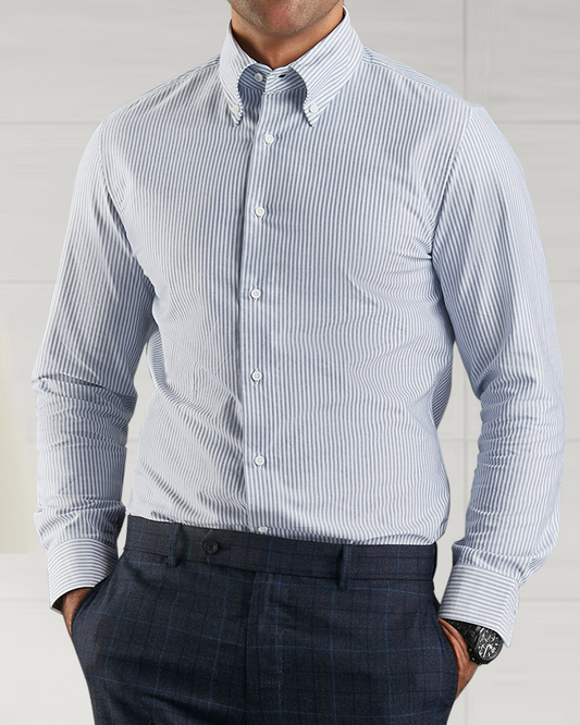 Close up of model wearing the custom oxford shirt for men by Luxire with navy university stripes