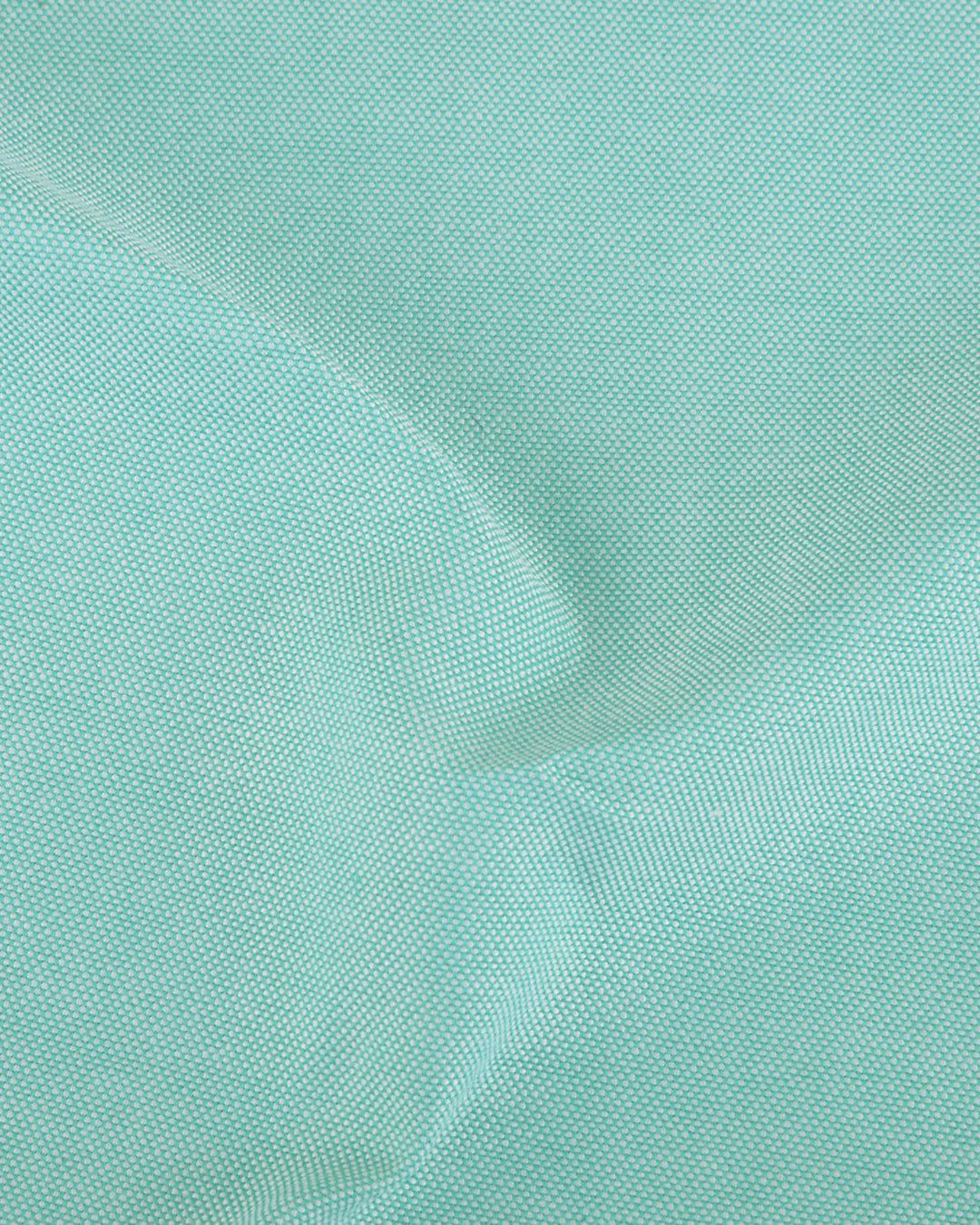 Close up of the custom oxford shirt for men by Luxire in pinpoint light green 2