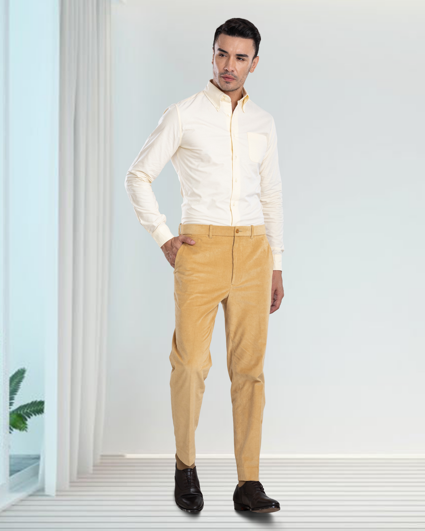 Model wearing the custom oxford shirt for men by Luxire in pale yellow hand in pocket