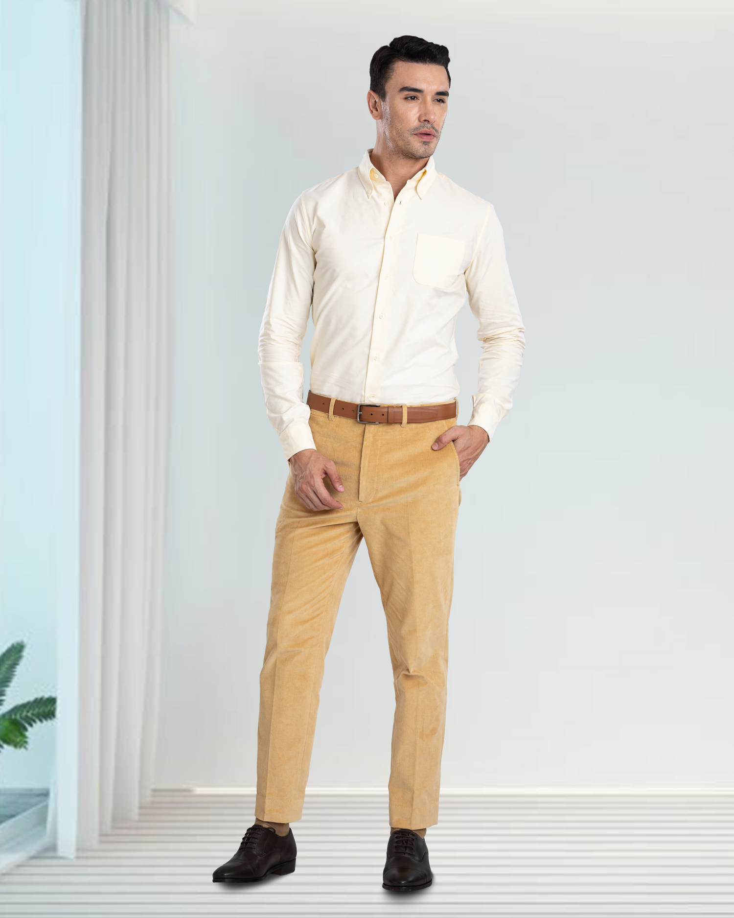 Model wearing the custom oxford shirt for men by Luxire in pale yellow hand in pocket 2