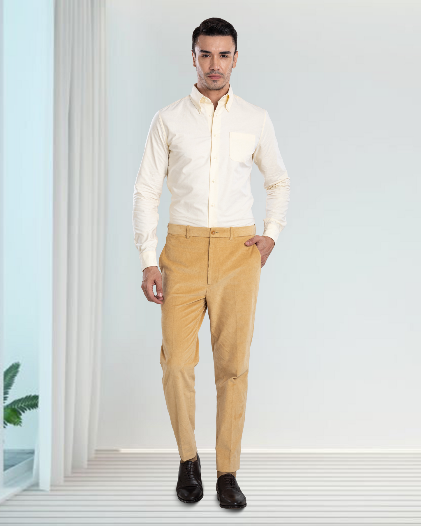 Model wearing the custom oxford shirt for men by Luxire in pale yellow hand in pocket 3