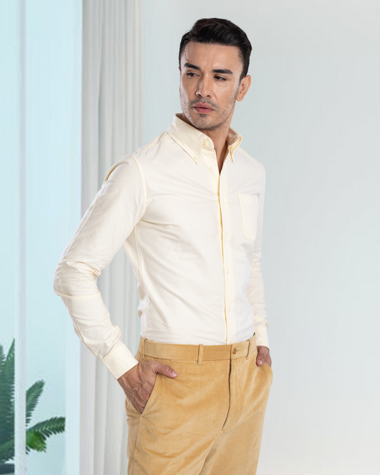 Side of model wearing the custom oxford shirt for men by Luxire in pale yellow