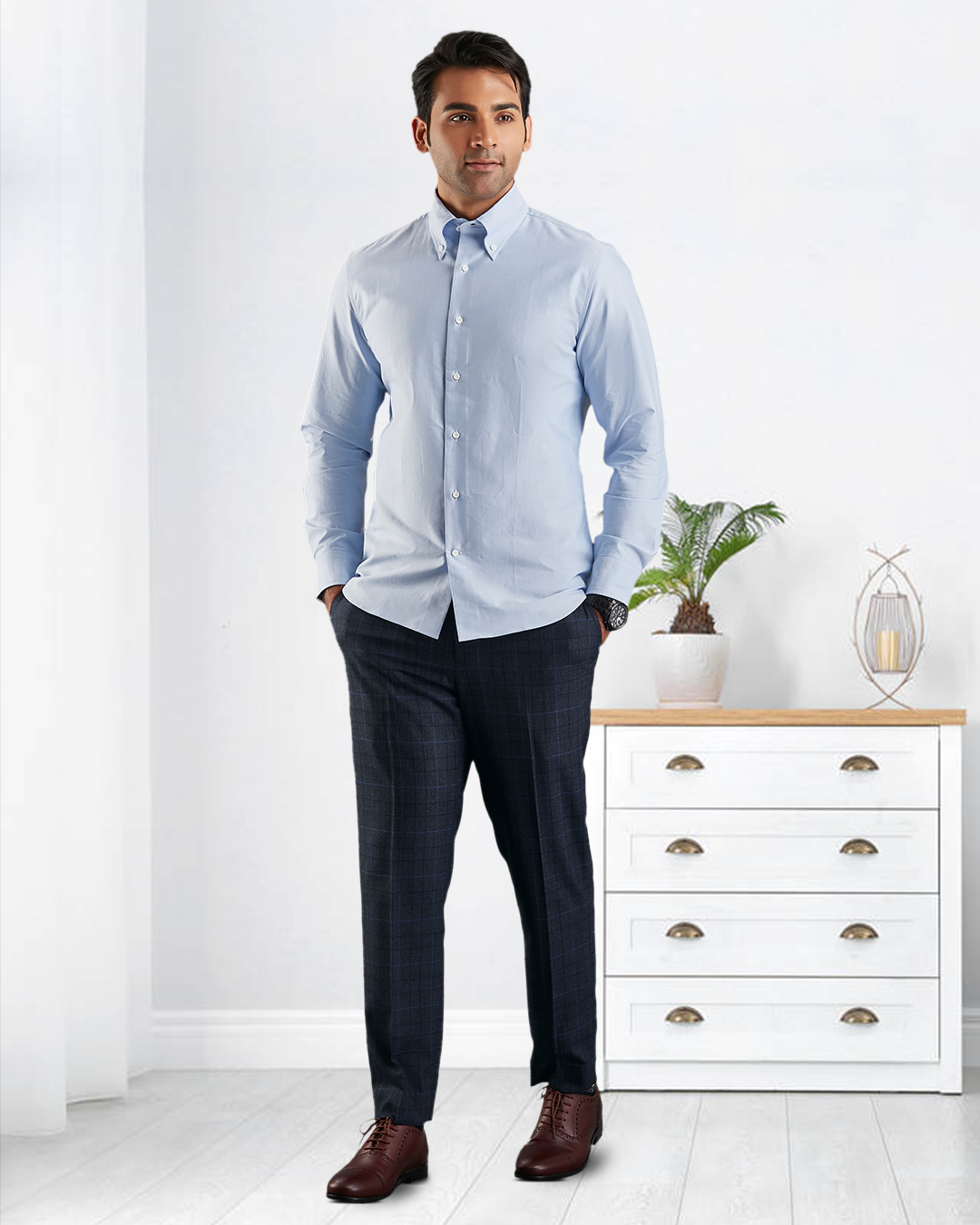 Model wearing the custom oxford shirt for men by Luxire in sky blue hands in pockets 2