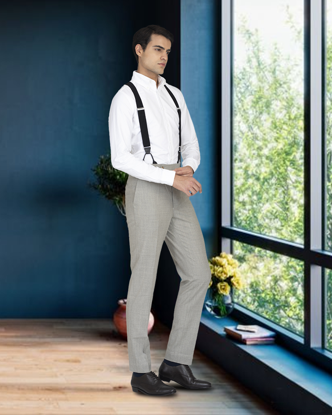 Model wearing the custom oxford shirt for men by Luxire in warzone white next to window
