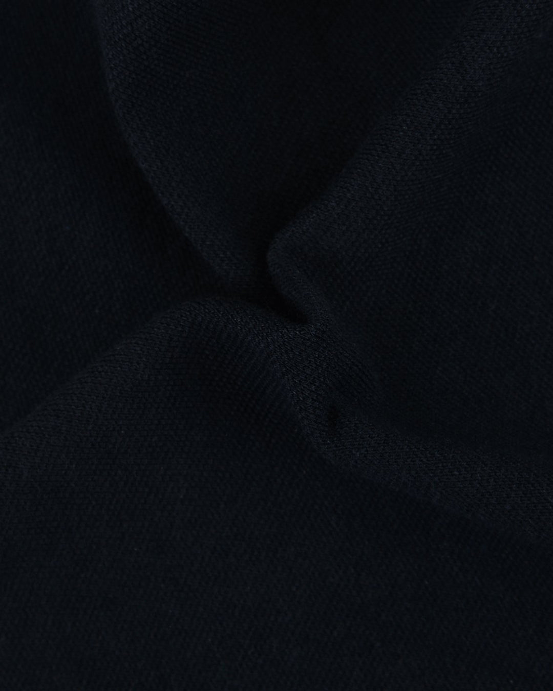 Close up fabric of the custom oxford polo shirt for men by Luxire in dark indigo