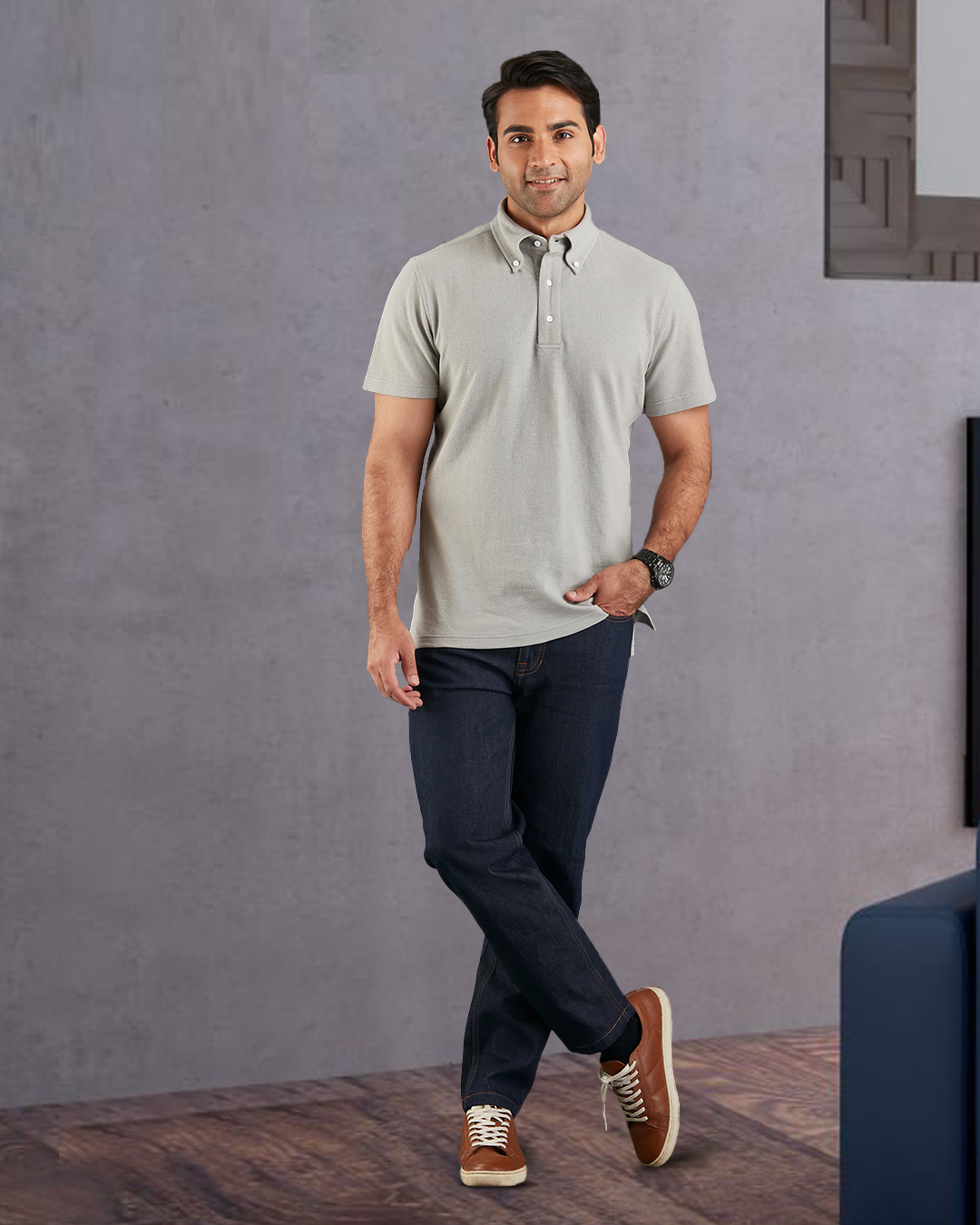 Front of model wearing the custom oxford polo shirt for men by Luxire in grey