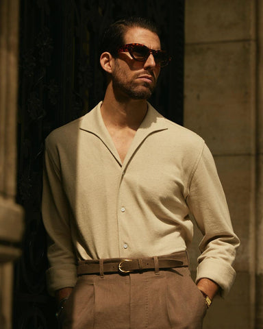 Model wearing the custom oxford polo shirt for men by Luxire in heather cream
