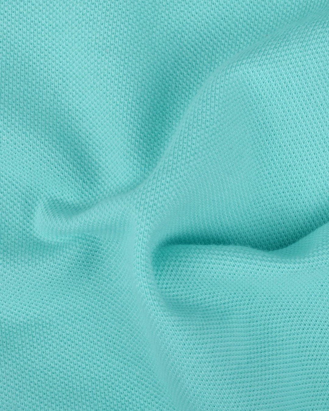 Close up of the custom oxford polo shirt for men by Luxire in ice blue 2